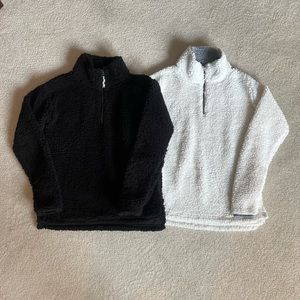 2 sherpas soft 3/4 zip shirts. XS w Stretch. 1 black 1 white